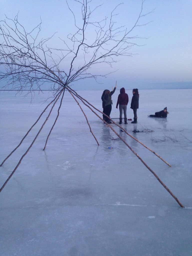 Girls fishing for smelts on a frozen Miramichi Bay